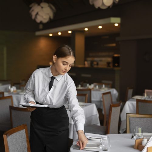 medium-shot-woman-working-luxury-restaurant